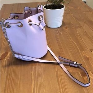 A light pink pouch purse
